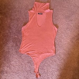 Pink turtleneck tank bodysuit